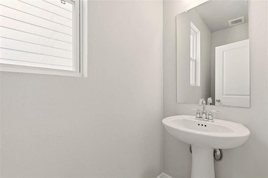 Half bathroom for guests perfectly located downstairs