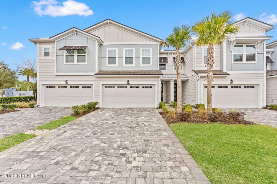 Front exterior of a new home in Pablo Cove, Jacksonville, FL, highlighting curb appeal (Image 24).