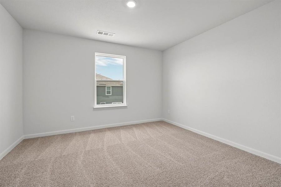 Unfurnished room featuring light carpet and recessed lighting
