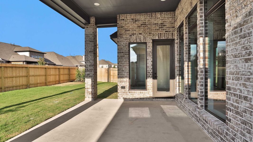 Exterior details and patio area of a home in Fulbrook On Fulshear Creek 60', Fulshear (Image 4).