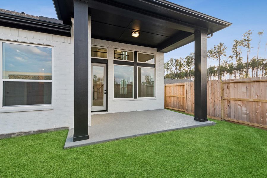 Exterior details and patio area of a home in The Highlands - Grove Collection, Porter (Image 4).