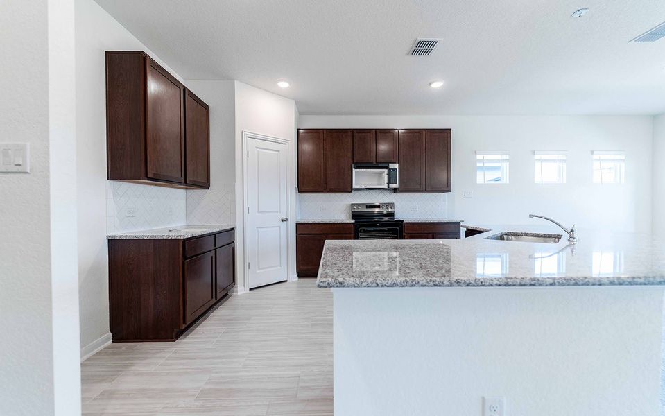 Furnished interior view inside a new home in Hannah Heights, Seguin (Image 3).