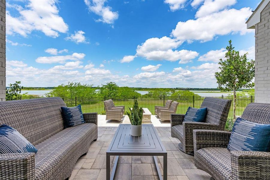 View of patio / terrace with a water view and an outdoor living space View of patio / terrace with a water view and an outdoor living space