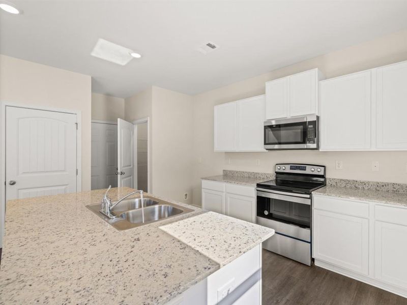 Furnished interior view inside a new home in Oaks at Cedar Grove, Fairburn (Image 4).