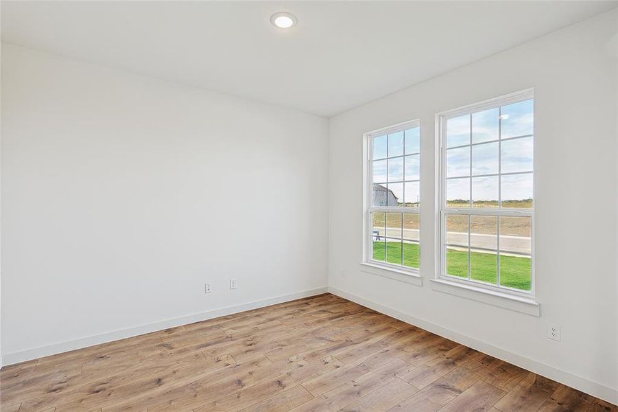 Spare room with light hardwood / wood-style flooring