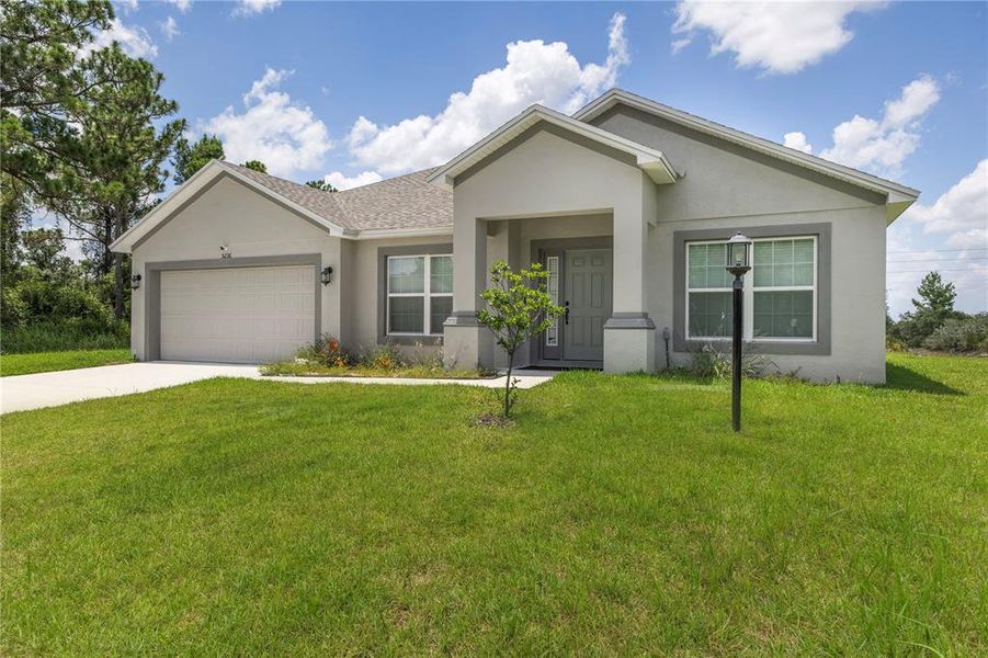 Front exterior of a new home in , Sebring, FL, highlighting curb appeal (Image 23).