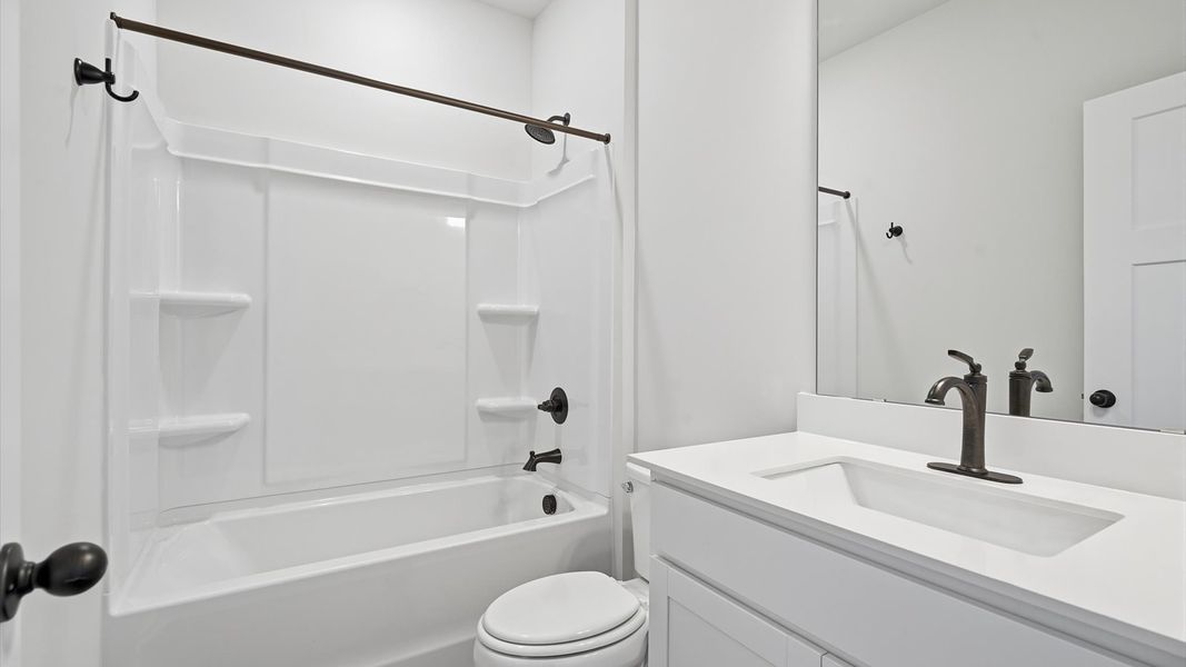 Elegant bath retreat with designer finishes and a clean, timeless aesthetic Elegant bath retreat with designer finishes and a clean, timeless aesthetic