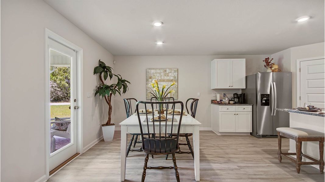 Representative furnished interior of a home built from the Cali by D.R. Horton in Owl's Head East, Freeport (Image 9).