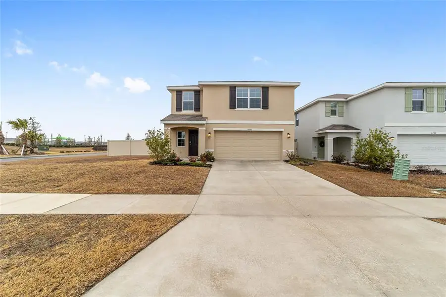 Front exterior of a new home in Ocala Crossings South, Ocala, FL, highlighting curb appeal (Image 2). Front exterior of a new home in Ocala Crossings South, Ocala, FL, highlighting curb appeal (Image 2).