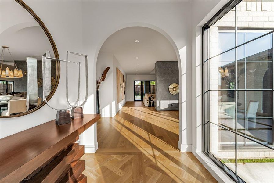 Foyer entrance with recessed lighting, arched walkways, and parquet flooring Foyer entrance with recessed lighting, arched walkways, and parquet flooring