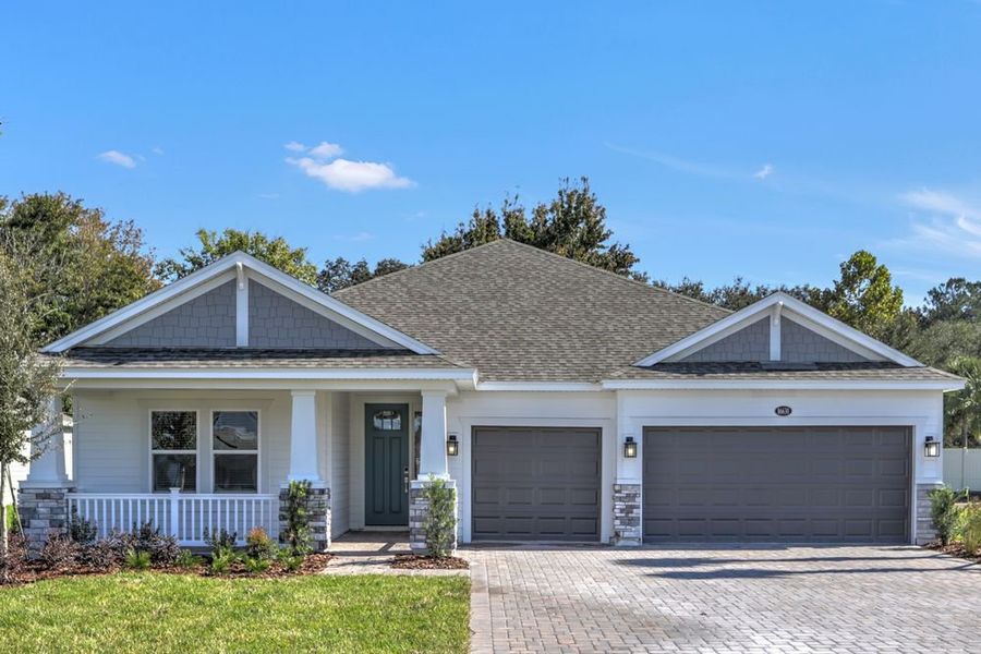 Front exterior of a new home in Headwaters at Lofton Creek, Yulee, FL, highlighting curb appeal (Image 1).