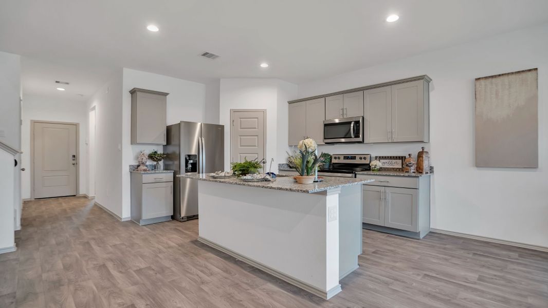 Representative furnished interior of a home built from the MITCHELL by D.R. Horton in Westward Pointe, Sealy (Image 7).