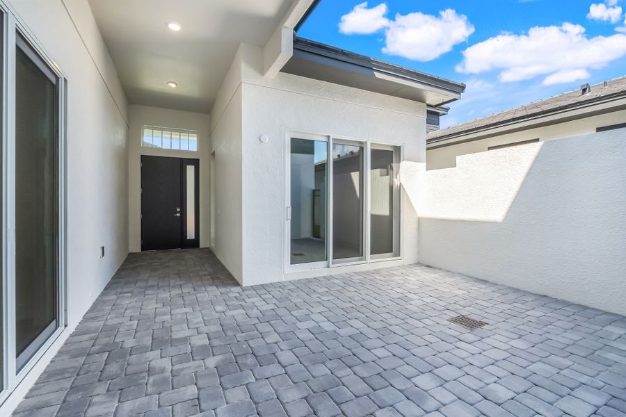 Exterior details and patio area of a home in Hampton Green at Providence, Davenport (Image 28). Exterior details and patio area of a home in Hampton Green at Providence, Davenport (Image 28).