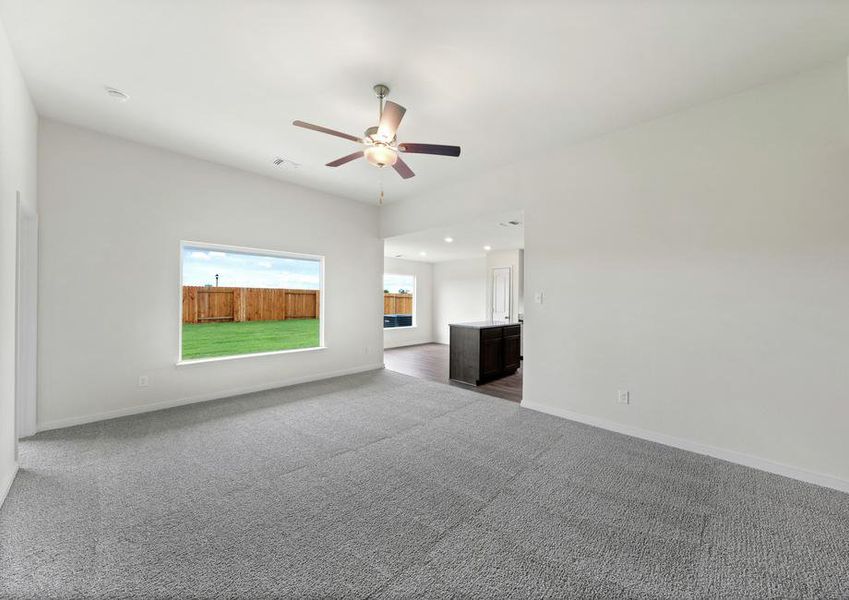 The open layout connects the family room with the kitchen and dining room.