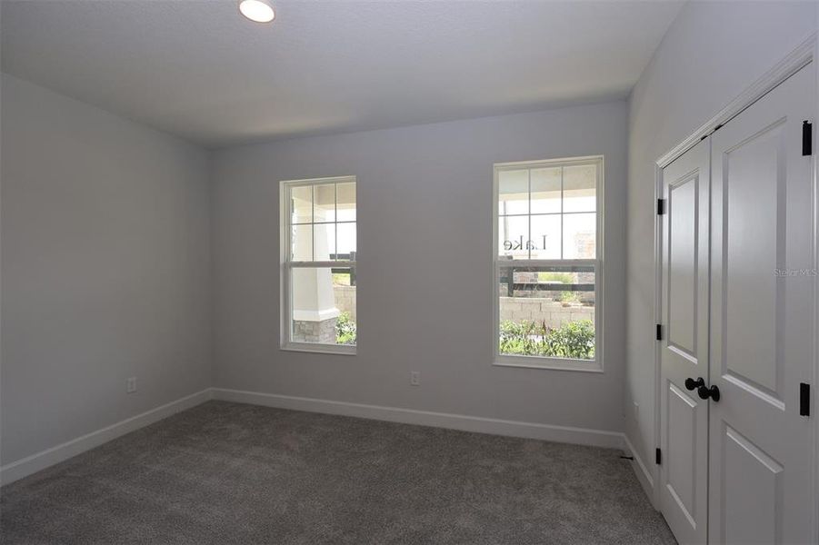 Spacious, unfurnished interior of a new home in Lake Star at Ovation, Winter Garden (Image 26).