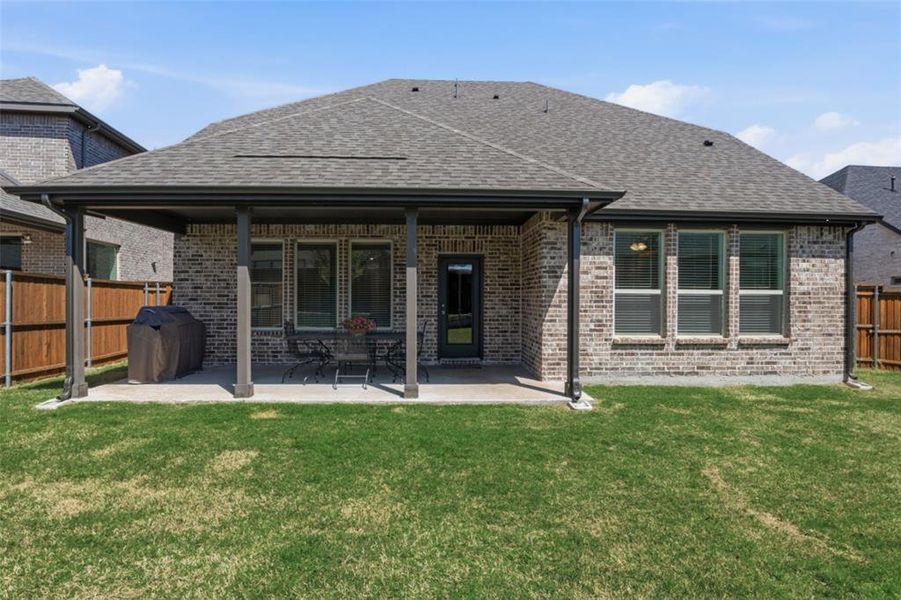Exterior details and patio area of a home in Whitewing Trails, Princeton (Image 4).