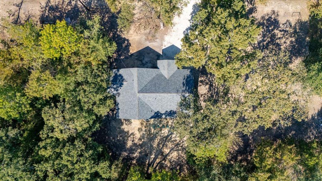 Front exterior of a new home in , Quinlan, TX, highlighting curb appeal (Image 2). Front exterior of a new home in , Quinlan, TX, highlighting curb appeal (Image 2).