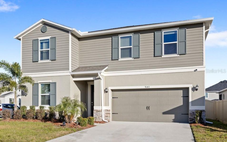 Front exterior of a new home in , Davenport, FL, highlighting curb appeal (Image 23). Front exterior of a new home in , Davenport, FL, highlighting curb appeal (Image 23).