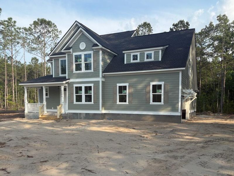 Front exterior of a new home in , Awendaw, SC, highlighting curb appeal (Image 2). Front exterior of a new home in , Awendaw, SC, highlighting curb appeal (Image 2).
