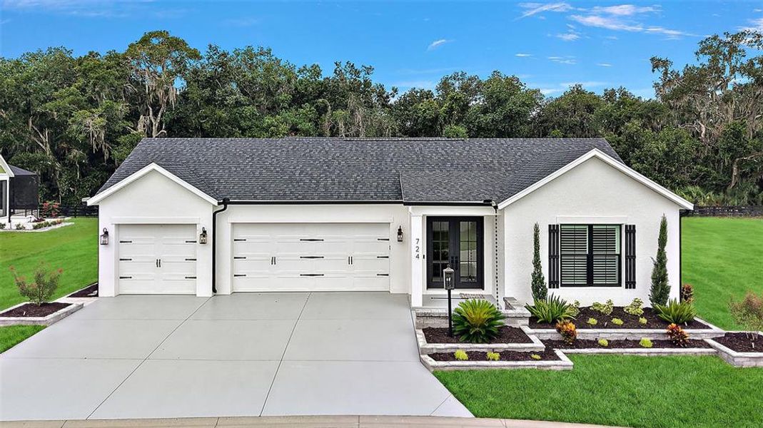 Front exterior of a new home in , The Villages, FL, highlighting curb appeal (Image 30).