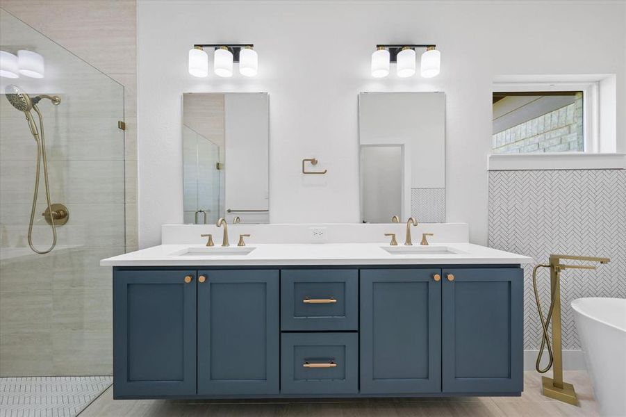 Bathroom with vanity, separate shower and tub.