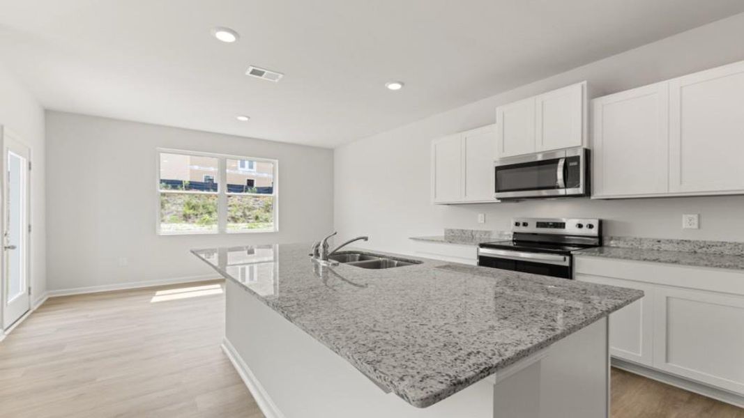 Furnished interior view inside a new home in Oaks at Cedar Grove, Fairburn (Image 6).