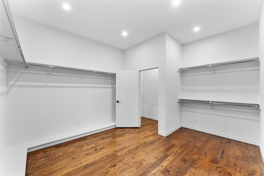 Walk in closet featuring wood finished floors
