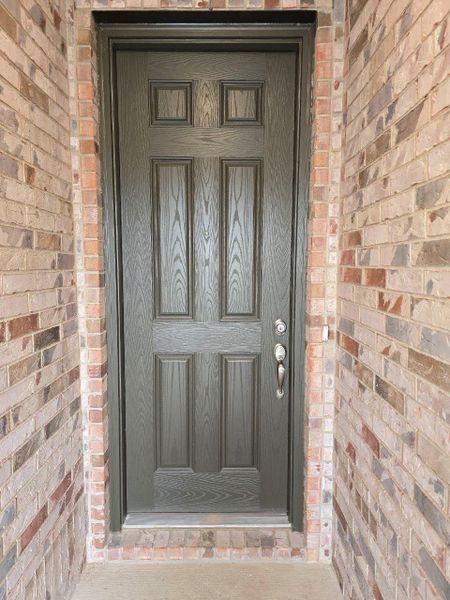 Front exterior of a new home in McKinney Crossing, Austin, TX, highlighting curb appeal (Image 20). Front exterior of a new home in McKinney Crossing, Austin, TX, highlighting curb appeal (Image 20).
