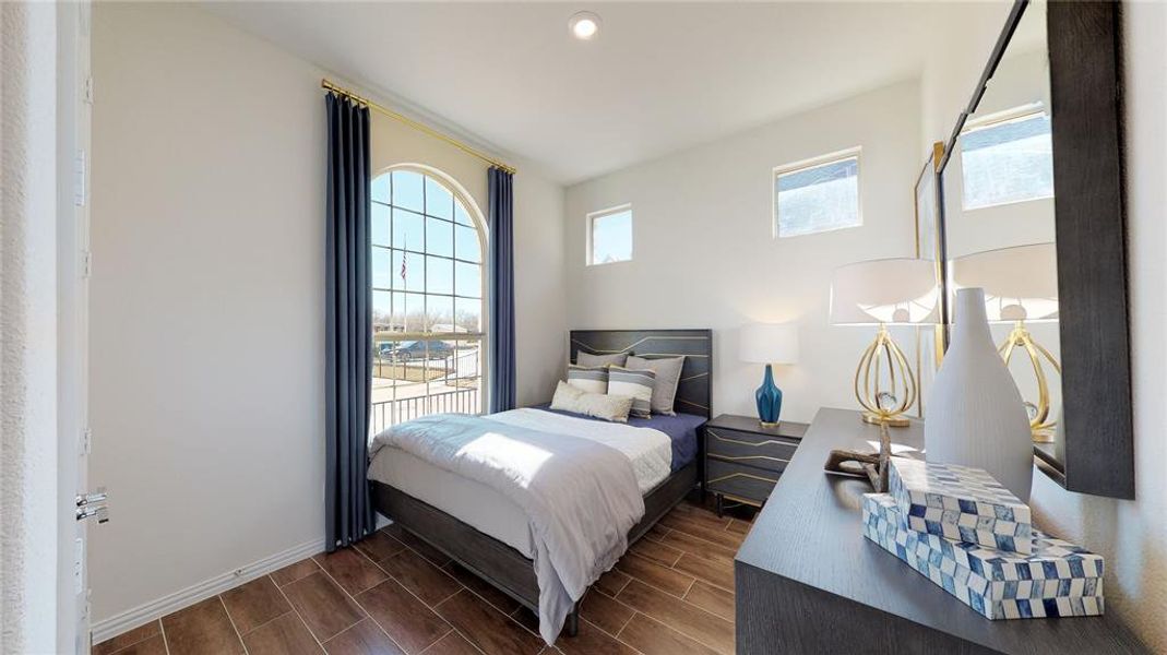 Bedroom with wood finish floors and recessed lighting