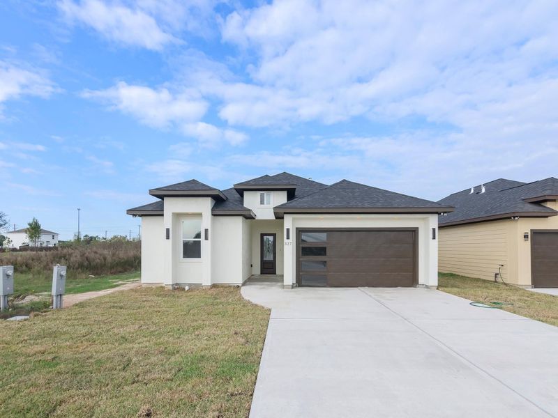 Front exterior of a new home in , Cleveland, TX, highlighting curb appeal (Image 1). Front exterior of a new home in , Cleveland, TX, highlighting curb appeal (Image 1).