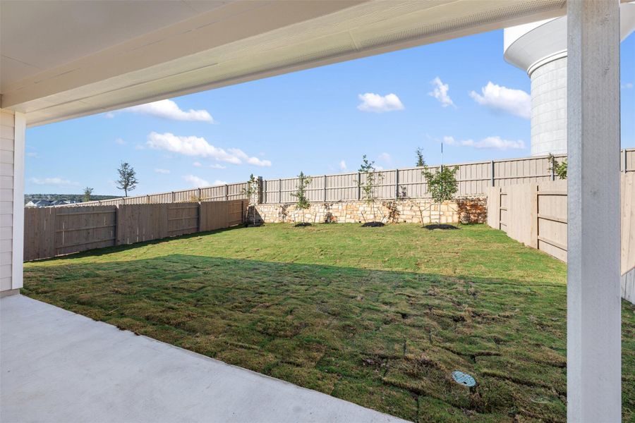Exterior details and patio area of a home in The Colony 50s, Bastrop (Image 16).