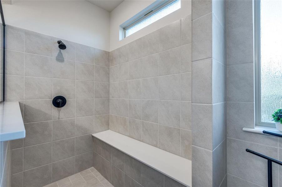 Bathroom featuring a tile shower