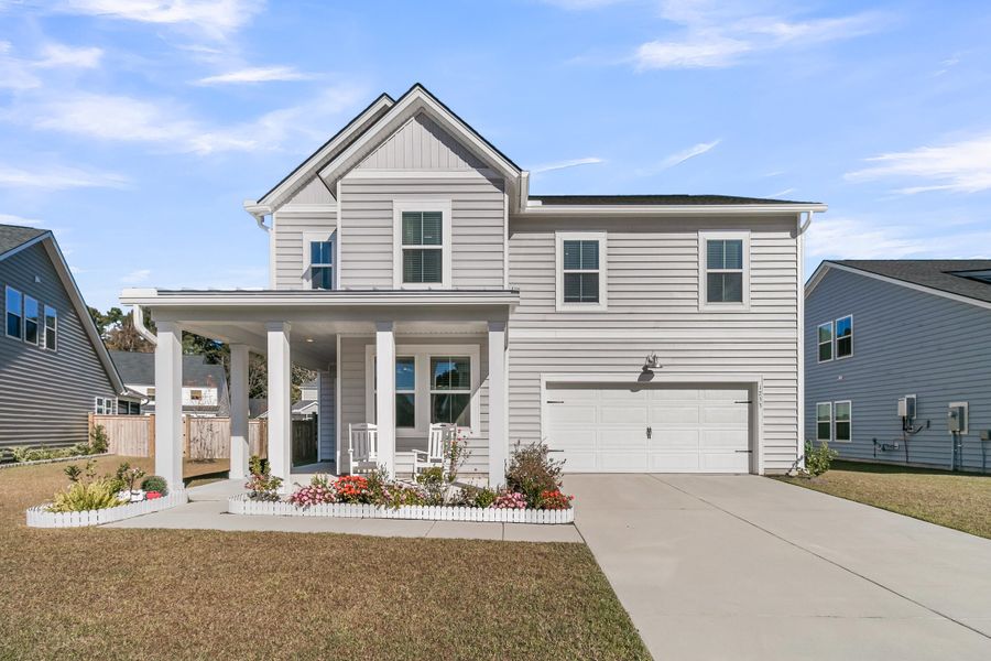 Front exterior of a new home in Sweetgrass at Summers Corner: Arbor Collection, Summerville, SC, highlighting curb appeal (Image 1). Front exterior of a new home in Sweetgrass at Summers Corner: Arbor Collection, Summerville, SC, highlighting curb appeal (Image 1).