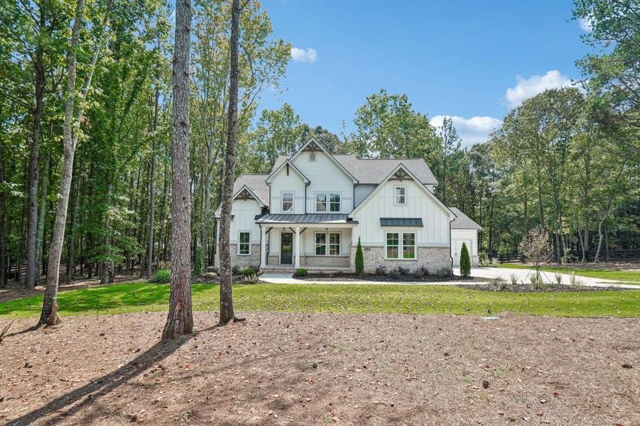 Front exterior of a new home in , Cumming, GA, highlighting curb appeal (Image 31).