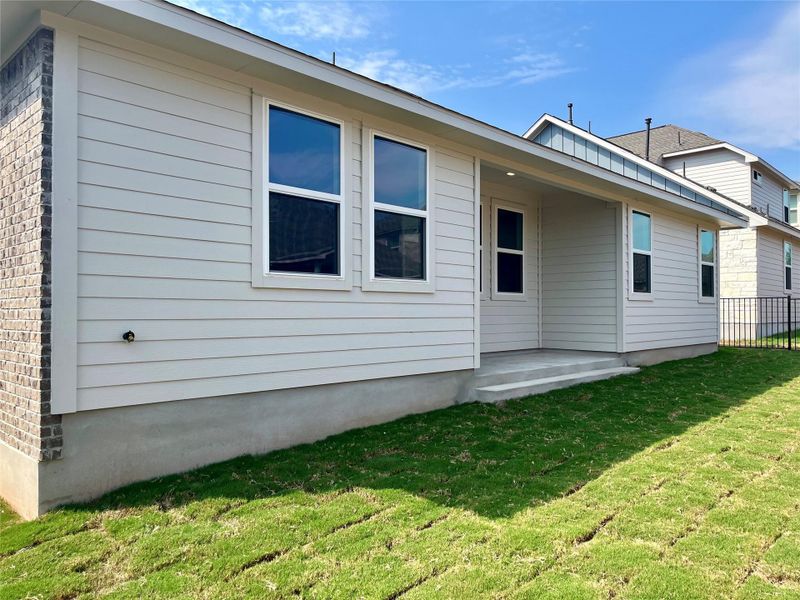 Front exterior of a new home in Anthem Cottages, Kyle, TX, highlighting curb appeal (Image 2).