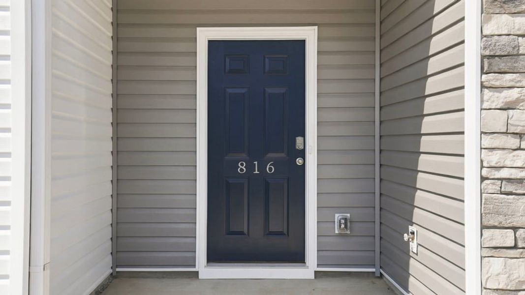 Exterior details and patio area of a home in Tanglewood Townes, Greenville (Image 4). Exterior details and patio area of a home in Tanglewood Townes, Greenville (Image 4).