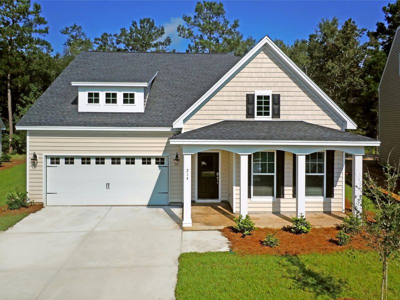 Front exterior of a new home in Sweetgrass at Summers Corner, Summerville, SC, highlighting curb appeal (Image 1). Front exterior of a new home in Sweetgrass at Summers Corner, Summerville, SC, highlighting curb appeal (Image 1).