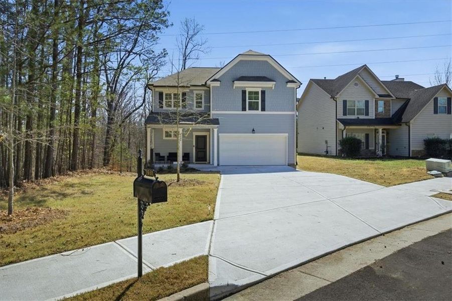Front exterior of a new home in Tell River, Atlanta, GA, highlighting curb appeal (Image 27). Front exterior of a new home in Tell River, Atlanta, GA, highlighting curb appeal (Image 27).