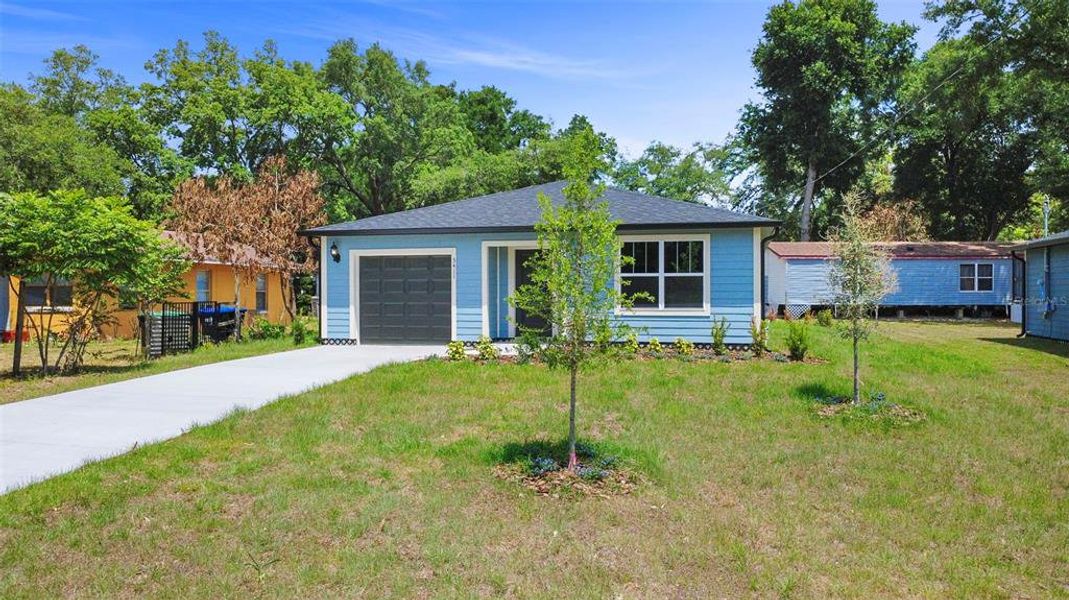 Front exterior of a new home in , Apopka, FL, highlighting curb appeal (Image 17).