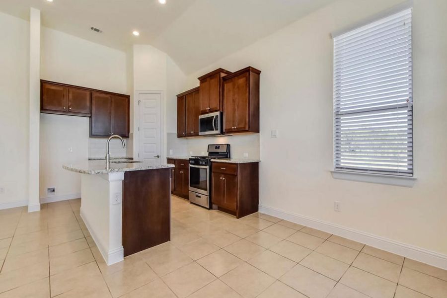Representative furnished interior of a home built from the Oaks 1596 by Brohn Homes in Oaks at San Gabriel, Georgetown (Image 7).