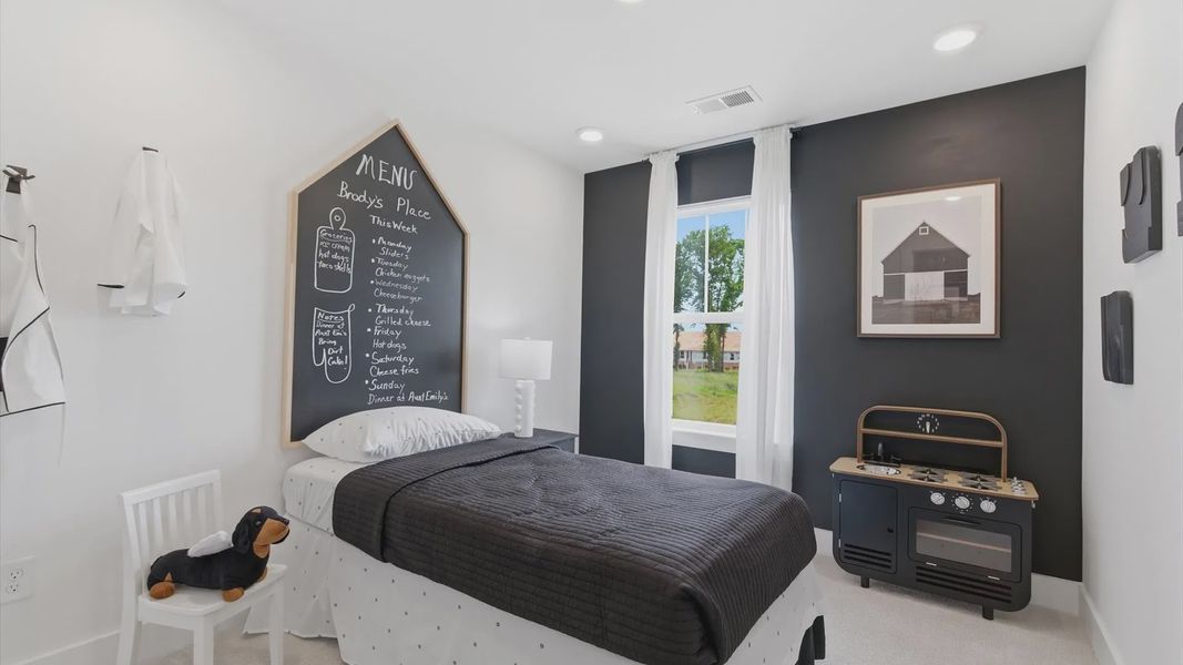 Churchill Design secondary bedroom offering warmth and everyday comfort at Clarke Townes