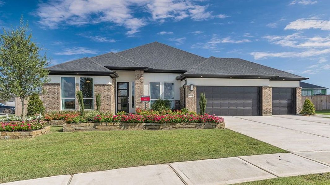 Representative exterior photo of a completed home built from the Jade by Taylor Morrison in Trillium, Richmond, TX (Image 18).