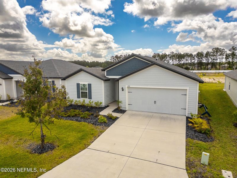 Front exterior of a new home in Westport Landing, Jacksonville, FL, highlighting curb appeal (Image 24).