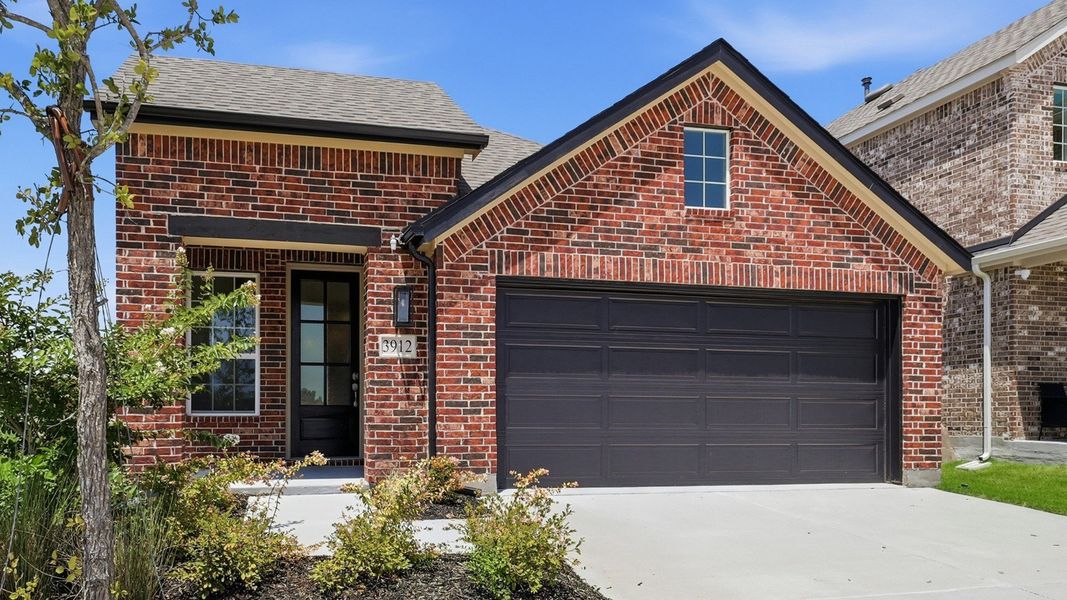 Front exterior of a new home in Bel Air Village, Sherman, TX, highlighting curb appeal (Image 21). Front exterior of a new home in Bel Air Village, Sherman, TX, highlighting curb appeal (Image 21).