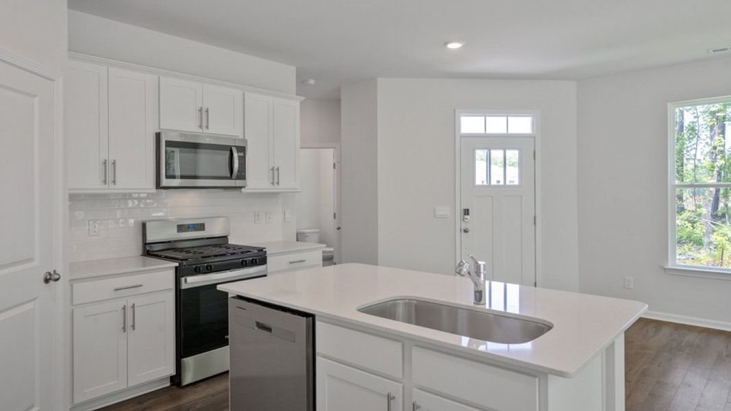 Representative furnished interior of a home built from the CARSON by D.R. Horton in Copper Run South, Durham (Image 4).