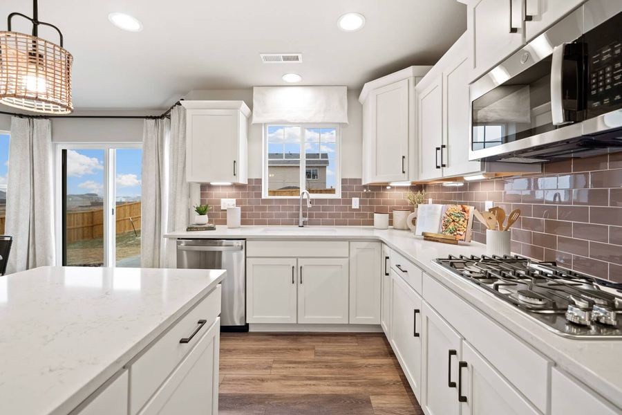 Representative furnished interior of a home built from the The Bellhaven by Challenger Homes in Sky Ranch - Highland Collection, Watkins (Image 14).