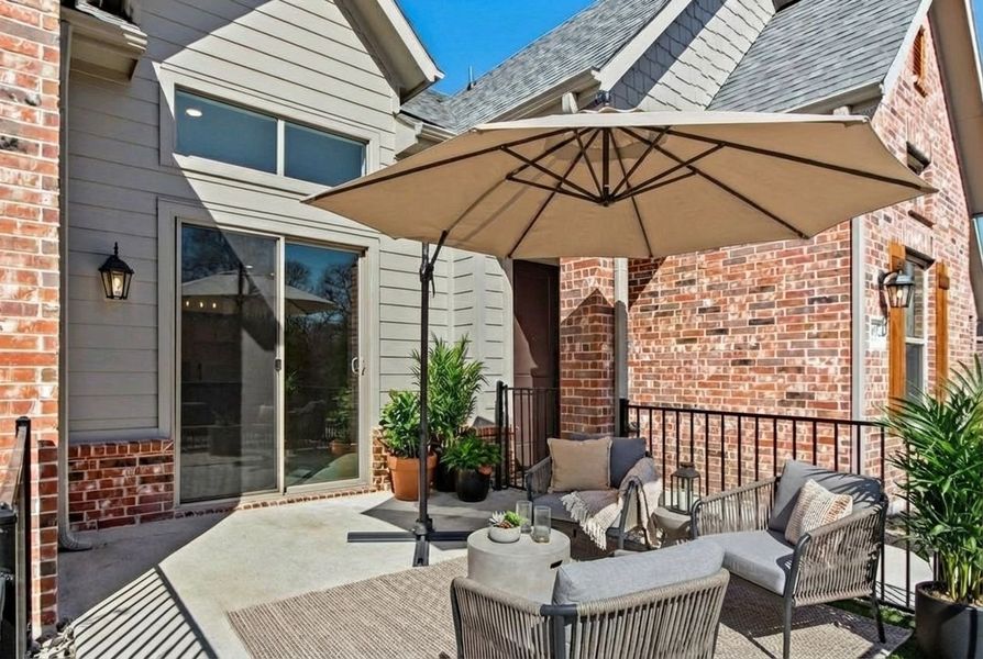 Exterior details and patio area of a home in Cottonwood Creek, Rowlett (Image 28).