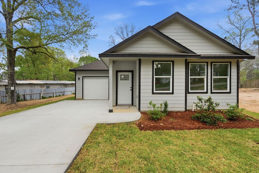 Front exterior of a new home in , Willis, TX, highlighting curb appeal (Image 19).