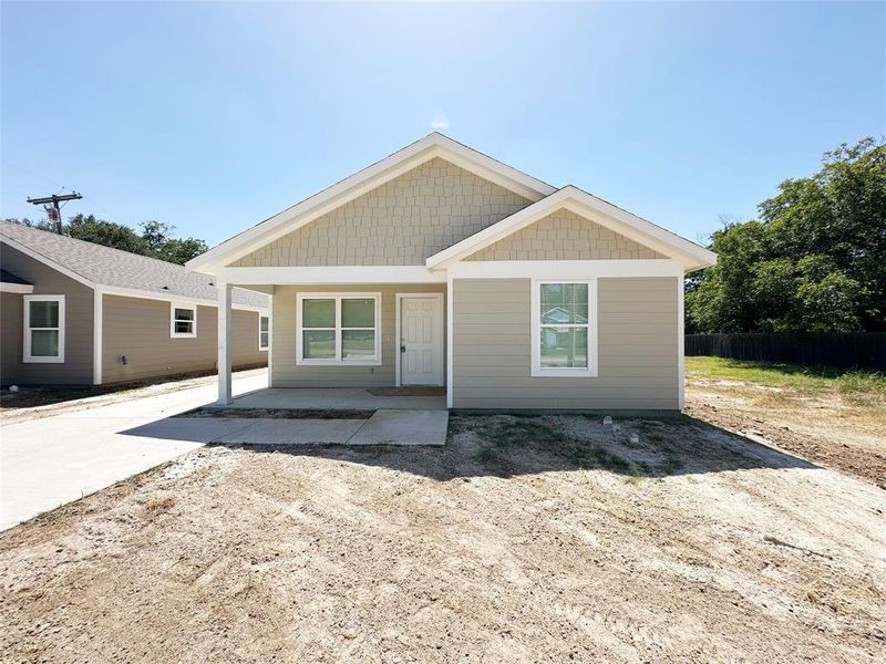 Front exterior of a new home in , Mineral Wells, TX, highlighting curb appeal (Image 2). Front exterior of a new home in , Mineral Wells, TX, highlighting curb appeal (Image 2).