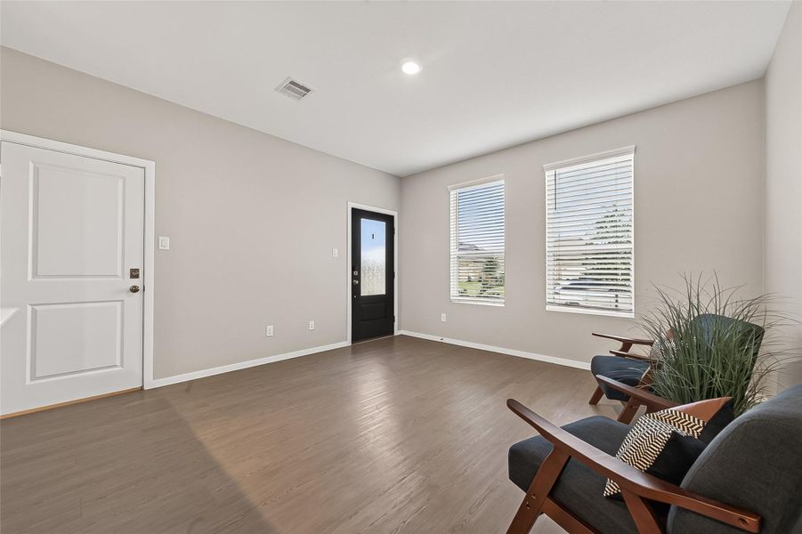 Spacious guest suite living area/flex area with abundant natural light, recessed lighting, and a flexible layout. Spacious guest suite living area/flex area with abundant natural light, recessed lighting, and a flexible layout.